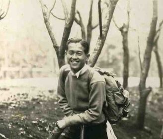 An old photo capturing an adventurous man hiking in the woods, equipped with the 10 Essentials for his outdoor adventure.