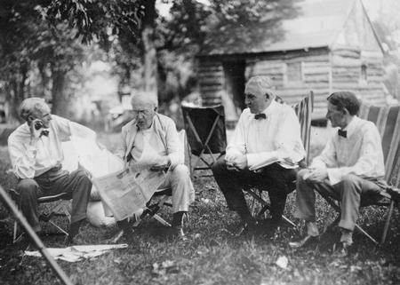 Henry Ford, Thomas Edison, Warren G. Harding and Harvey Firestone having a discussion.
