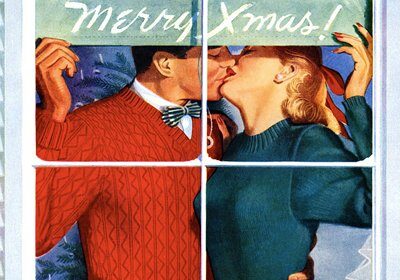 A romantic couple sharing a passionate kiss in front of a merry Christmas sign as they celebrate the holidays together.