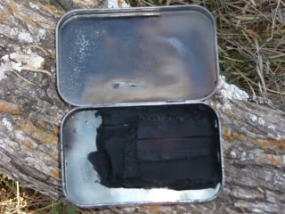 Altoids tin using for charcloth maker.