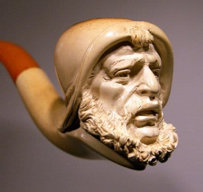 A Meerschaum pipe, resembling the King of Pipes, featuring a man's head.