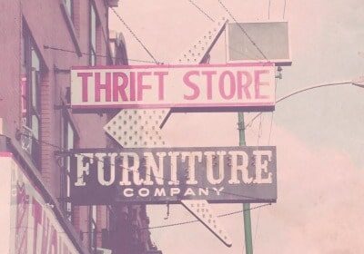 Thrift store sign offering top-quality furniture products and thrifting tips.