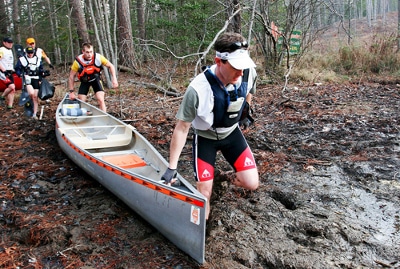 Men hauling canoe for racing.