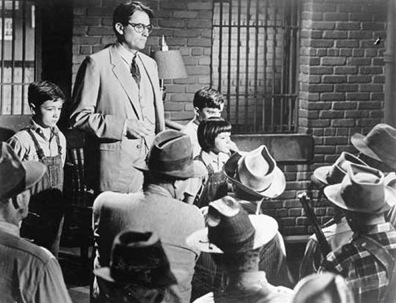 Gregory Peck addressing in front of public. 