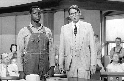 Gregory Peck standing in court with Thomas Robinson.