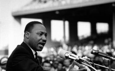 Martin Luther King Jr delivering a powerful speech using the principles of arrangement from classical rhetoric.
