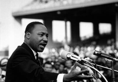 Martin Luther King Jr delivering a powerful speech using the principles of arrangement from classical rhetoric.