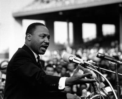 Martin Luther King Jr delivering a powerful speech using the principles of arrangement from classical rhetoric.