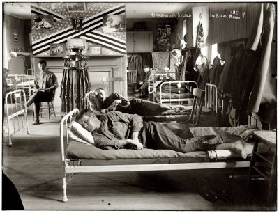 Vintage men sleeping on bunks.