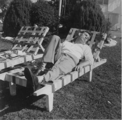 Vintage man napping in lounge chair at outside lawn.