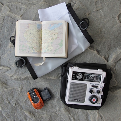 Collection of communication devices and map book.