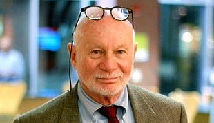 An older man in a suit, showcasing the Art of Manliness.