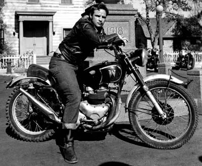 Marlon Brando riding on motorcycle. 