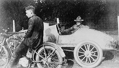 Charles Lindbergh enjoying the motorcycle race.