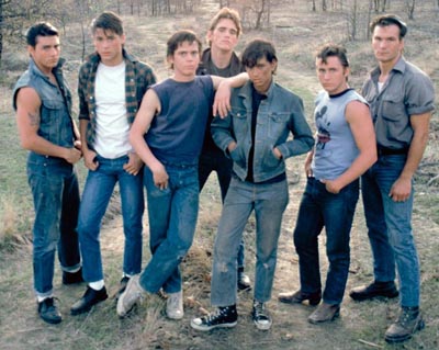 A group photo of young men wearing denim jeans.