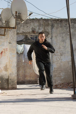 Jason Bourne running on rooftop. 