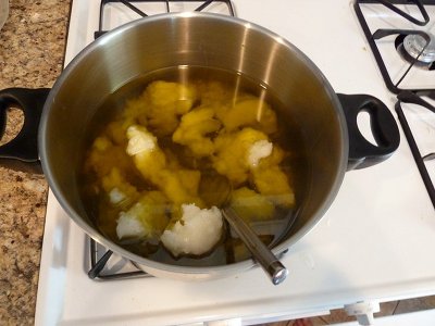 Heating the oils on stove. 