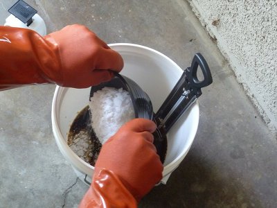 Man mixing liquid base and lye for homemade soap bars. 