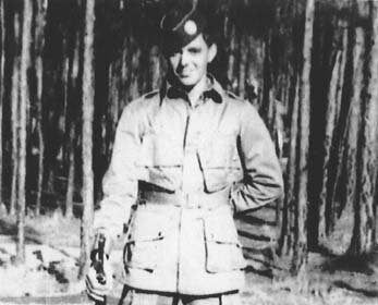A confident man, Shifty Powers, holding a rifle in a black and white photo.