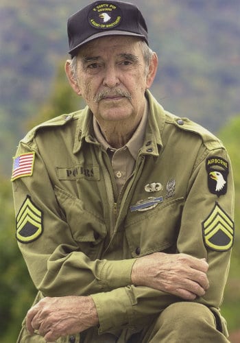 Older man wearing military uniform. 