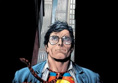 Superman showcasing his heroic abilities while dressed in a suit and tie in front of a building.