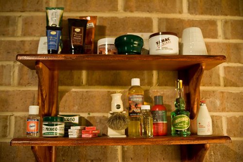 Barbers stuff on a wall stand.