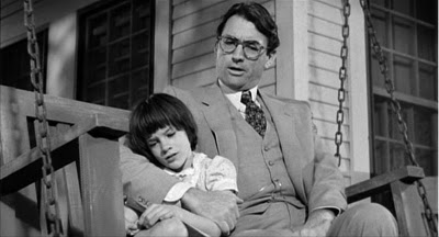Atticus and scout sitting together in To kill a Mockingbird movie.