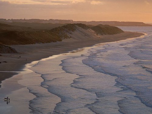 Beach front ocean at dusk dawn.