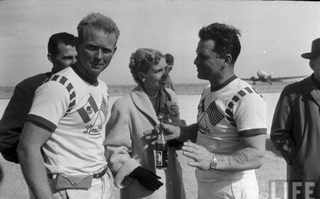 Two men in white t-shirts learning another language.