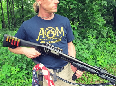 A man armed with the Ultimate Survival Shotgun cautiously navigates through the dense woods, prepared for any potential Zombie Apocalypse.