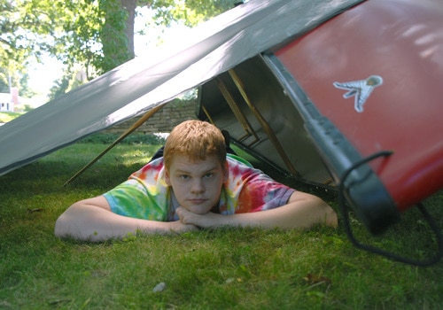 Man laying under the shelter.