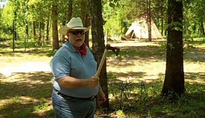 A man holding tomahawk.
