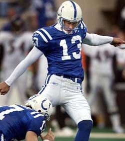 Indianapolis Colts quarterback person kicks the ball during a game, showcasing their clutch skills.