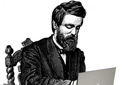 A gentleman sitting at a desk with a laptop, exemplifying civility online in the age of the internet.