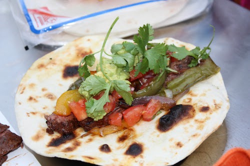 Skirt steak fajitas with vegetables cilantro.