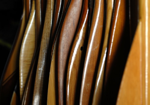Collection of canoe wooden paddles close up photo.