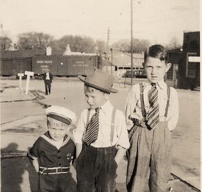 Three boys in sailor suits, embodying the Boyhood Archetypes, standing next to each other.
