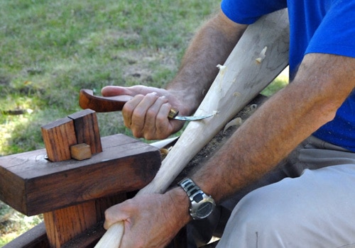 Men removing extra wood.