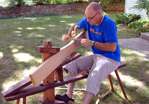 Making canoe paddle shaving planing wood shaving bench.