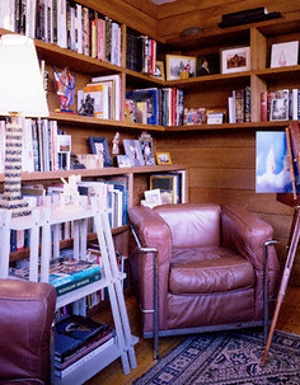 Leather chair in the corner of room.