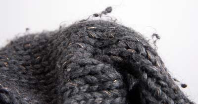 Close up sweater wool pilling.