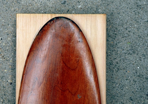 Tracing canoe paddle trace top of paddle on board.