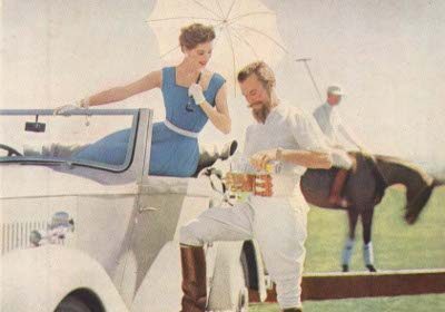 Two brand icons standing next to a car.