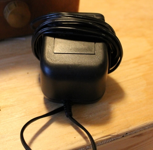 12 Volt power supply charger cord wrapped around.
