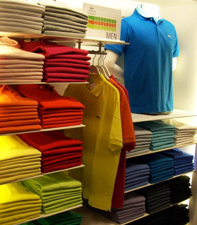 Colorful polo shirt on shelves.