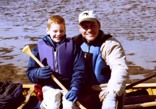 A father with son in a boat.