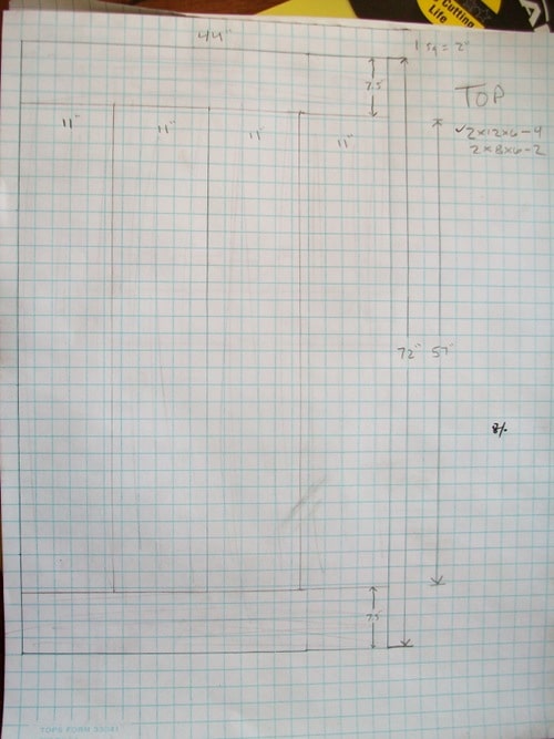 Drawing table measurements on grid paper.