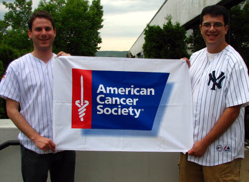 Men elloborating the american cancer society poster.