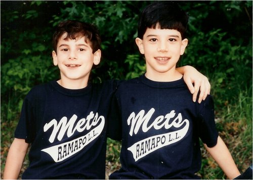 Young boys wearing matching shirts. 