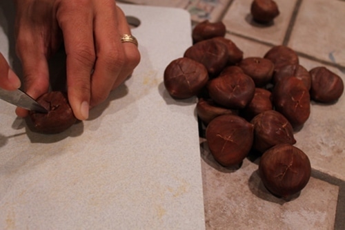 Cutting the edges of the chestnuts.